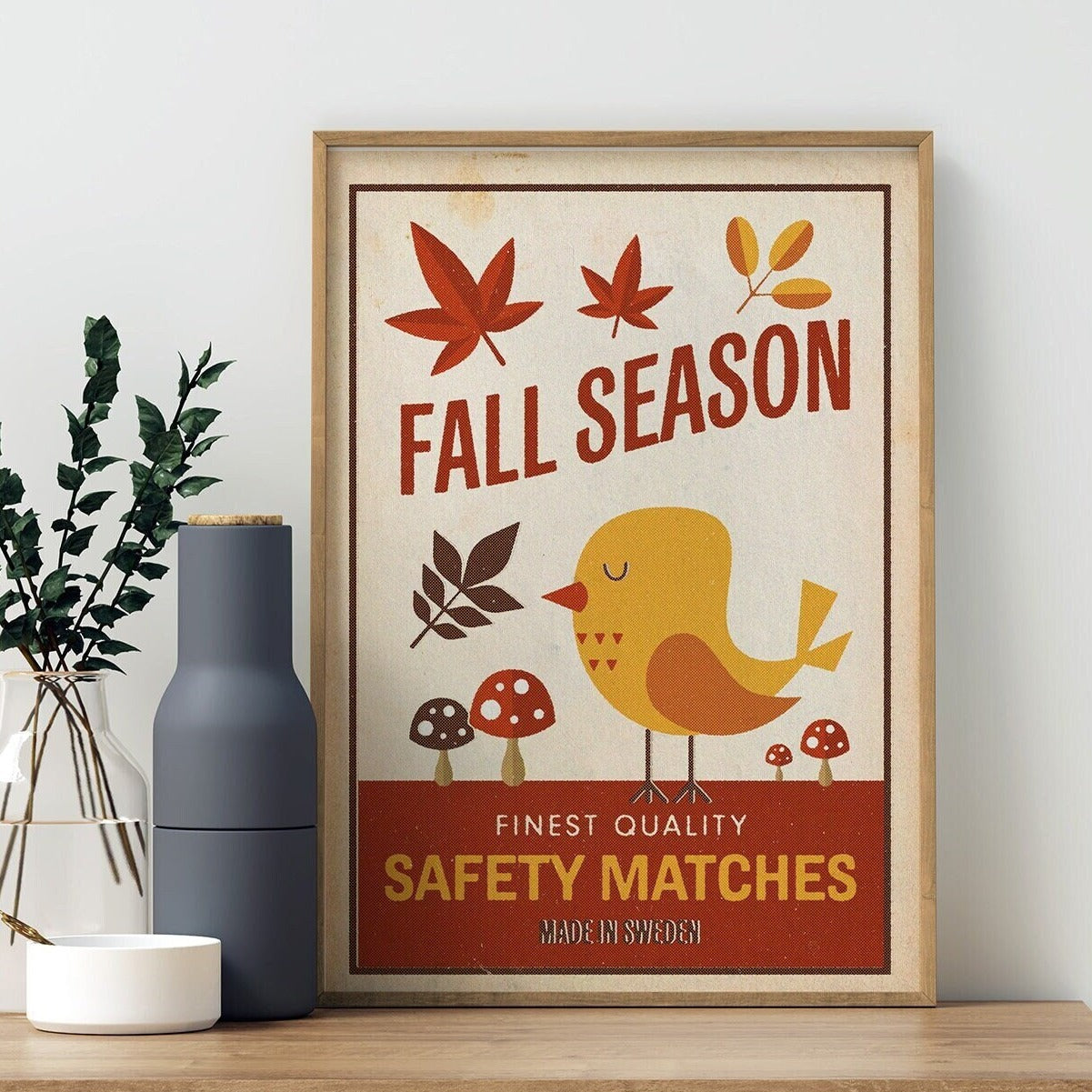 A cute retro style print featuring a bird with mushrooms and leaves in autumnal or fall colours